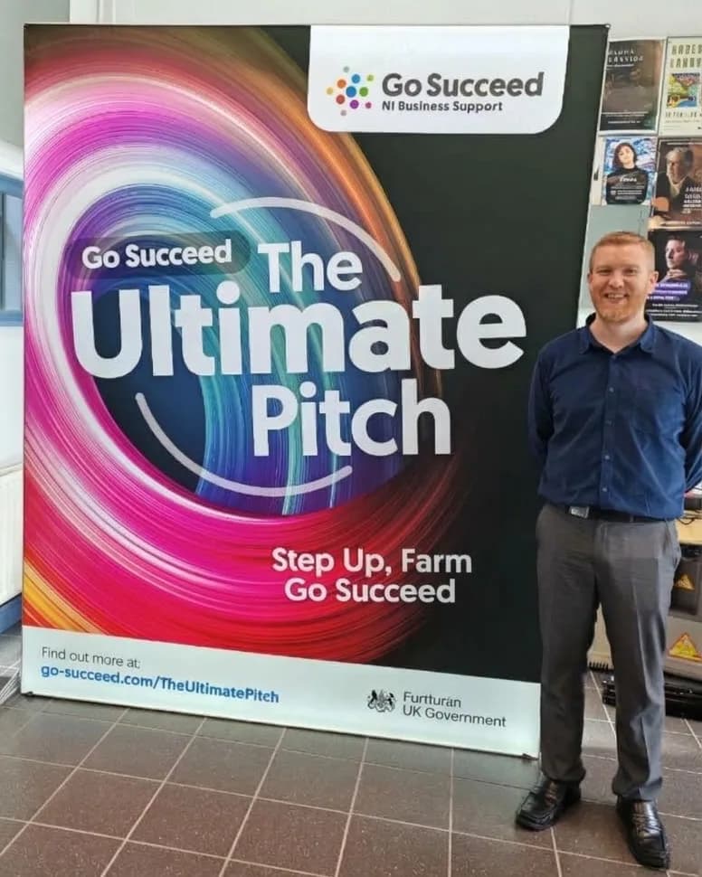 Darren Laverty beside the Go Succeed Ultimate Pitch banner at the Causeway Coast and Glens heat